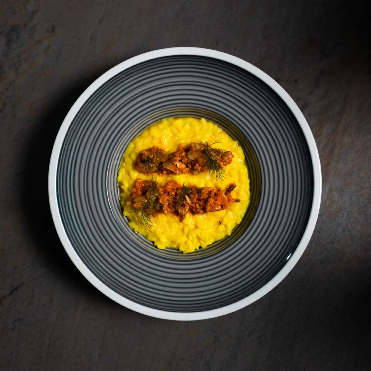 Risotto alla curcuma con ragù di dentice